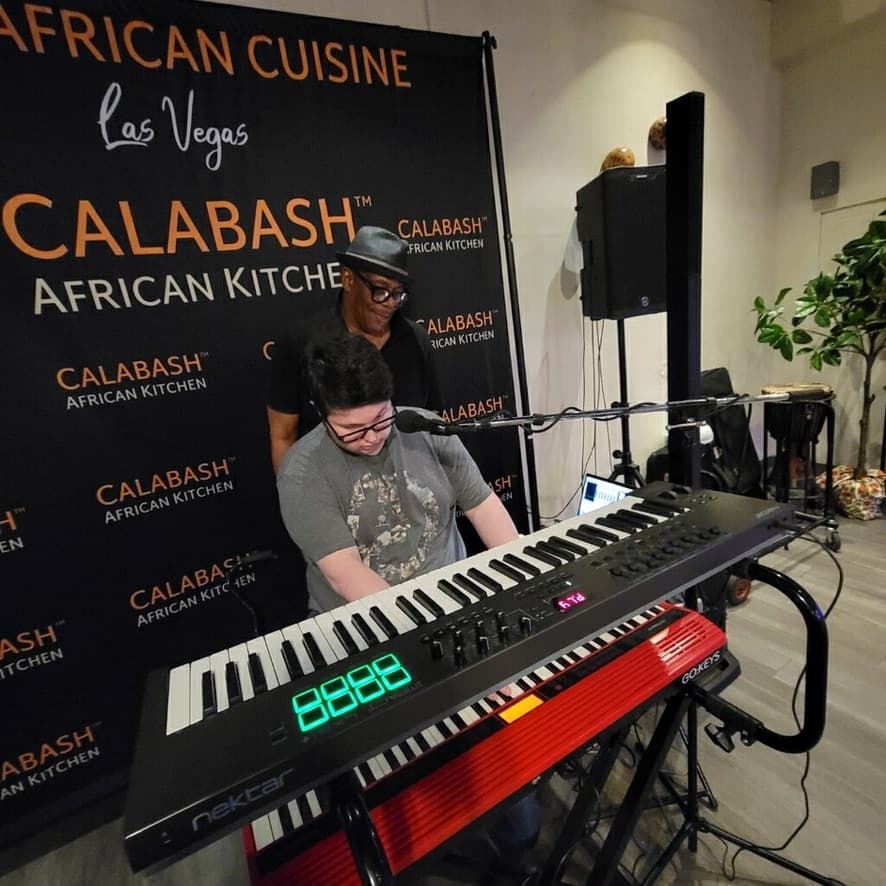 METLC student performing keyboard with KC at Calabash African Kitchen in Las Vegas.