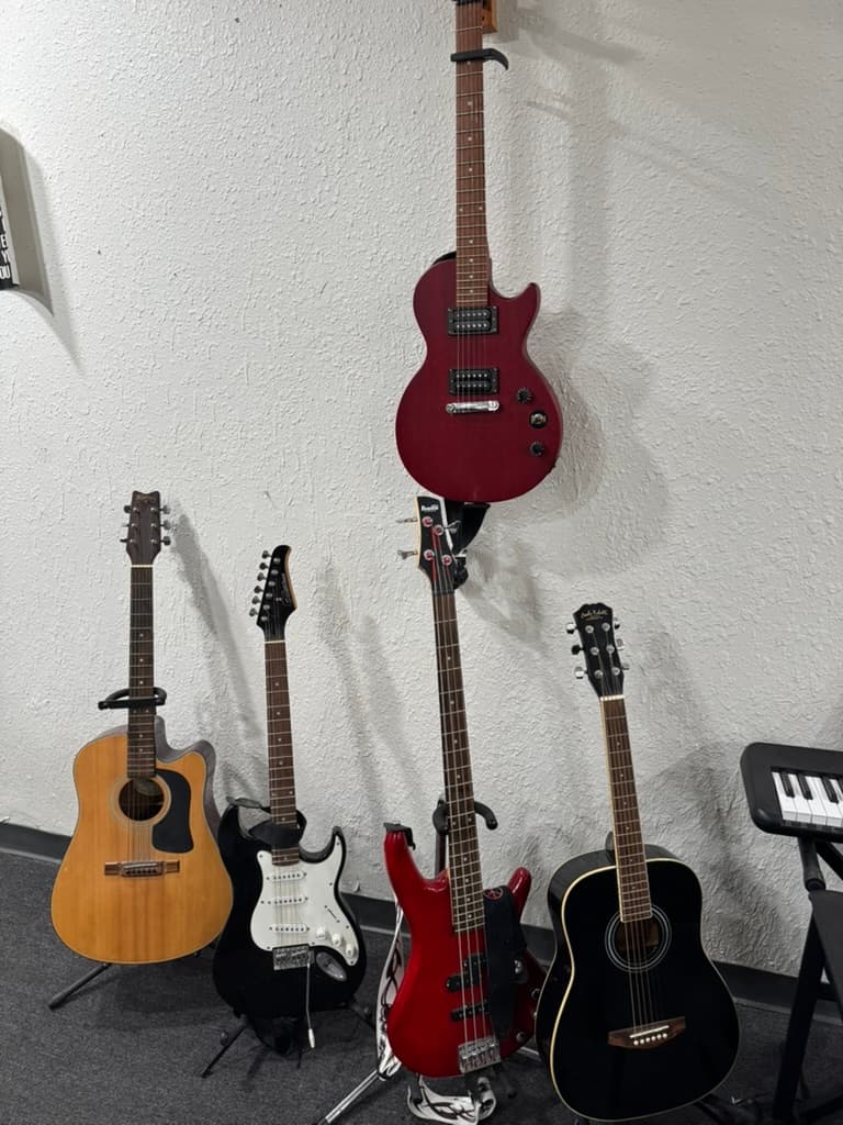 Guitars displayed on the wall inside METLC.